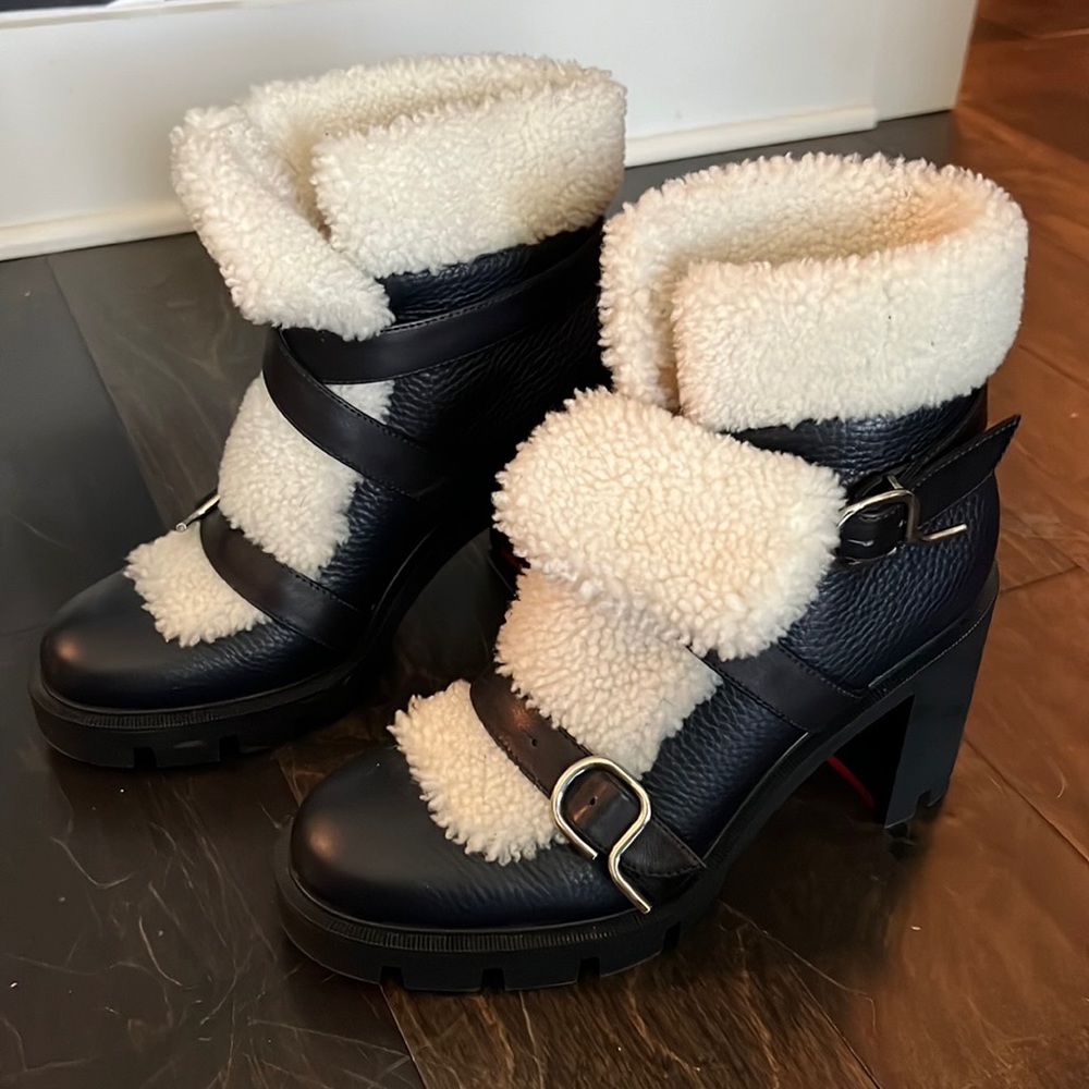 Black leather and shearling Christian Louboutin chunky heel boot.